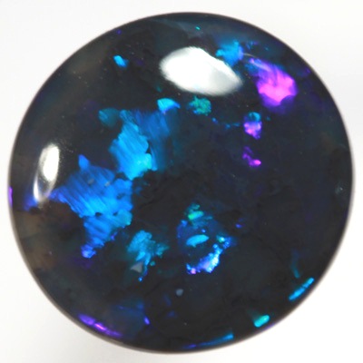 SOLID BLACK OPAL Very bright electric turquoise fire. SEE VIDEO
